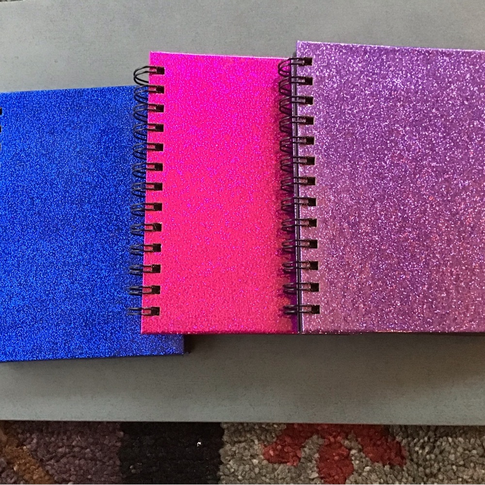 Three 5x7 photo albums